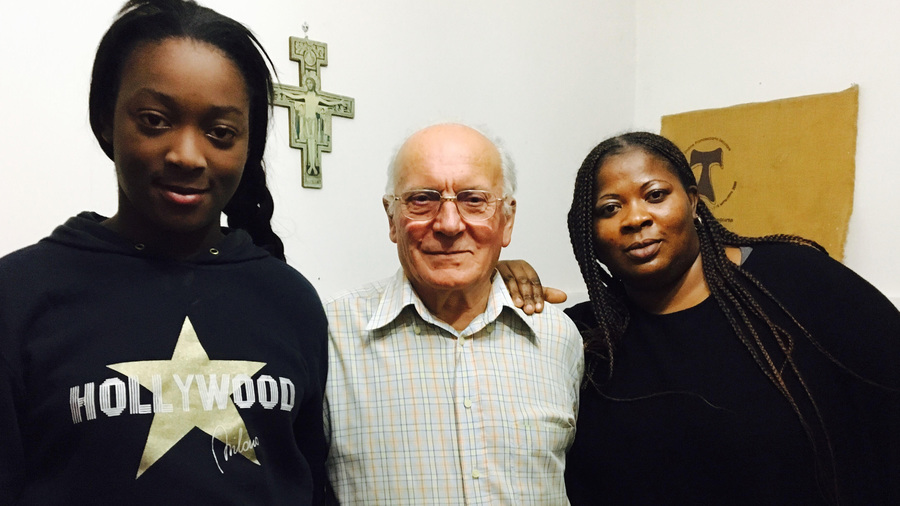 Gloria, Ricciardi Amedeo and Pat Three people pose for a photo together: a woman in her thirties on the right, her daughter, a teenager, on the left, and an older man in the middle
